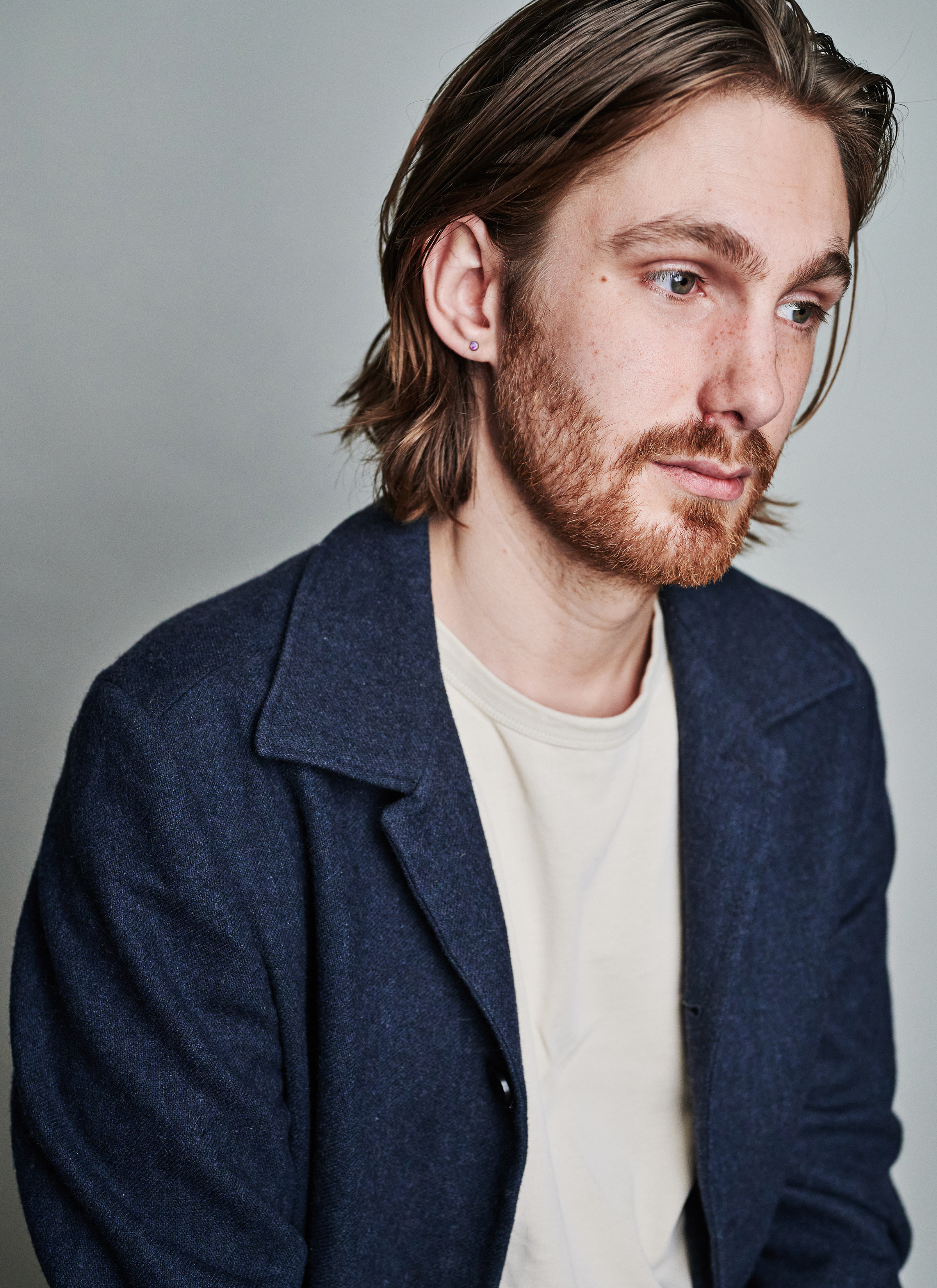 Portrait of Nick Howden-Steenstra, navy coat, by Ruth Crafer